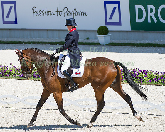 Piggy French riding Jakata taking part in the dressage test