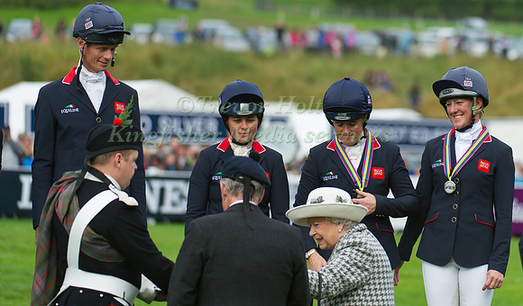 Her Majesty Queen Elizabeth II presents silver medals to the British Team