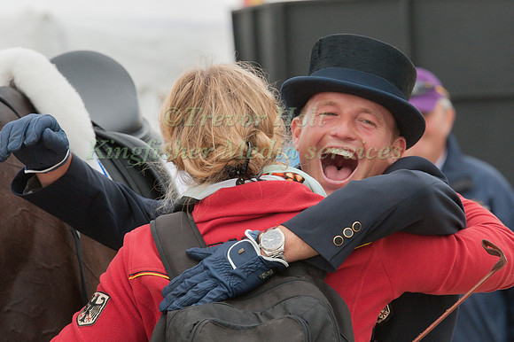 Michael Jung celebrates with hid groom after the dressage