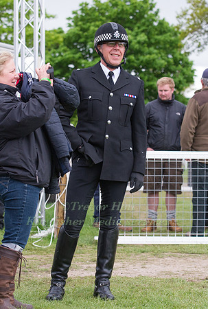 A police officer watches as his horse is takes part in the parad