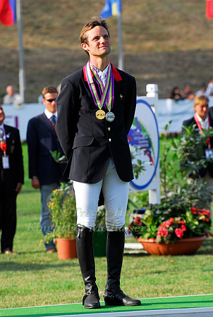 Nicolas Touzaint celebrates Individual Gold and Team Silver