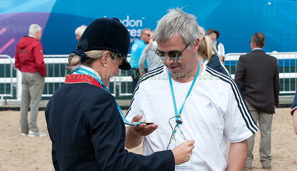 Alex Lahore admires Piggy French's Medal at the Olympic Test Event