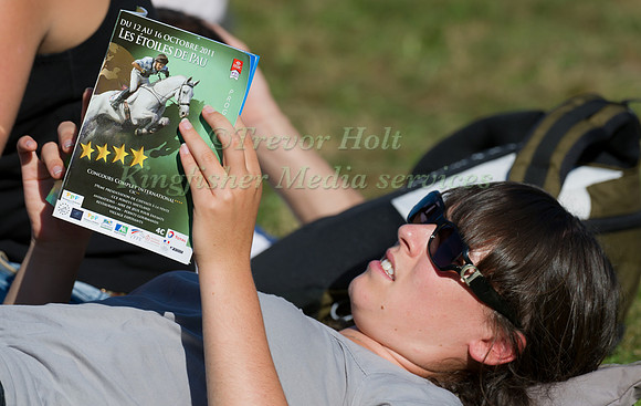 Spectator relaxes during a break in the Cross Country
