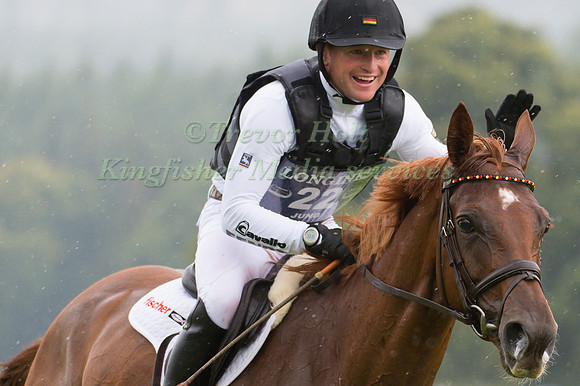 Michael Jung of Germany pats his horse Fischer Takinou