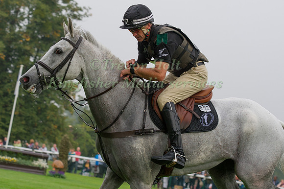Andrew Nicholson (NZL) riding Avebury checks his watch on the Line