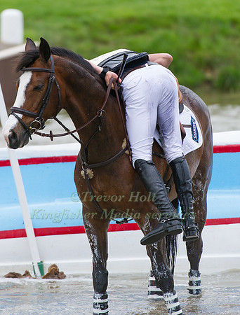Tim Price remounts   Wesko after a fall at the lake
