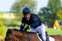 Tom How checking his watch approaching the finishing line