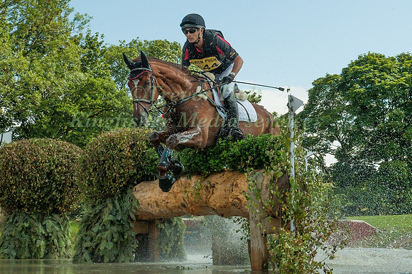 Tian  Alex   Hua (CHN) riding Don Geniro