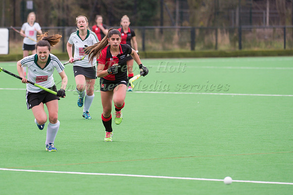 Womens Lilly Wolstenholme of Bowdon Hightown chases the ball league Hockey