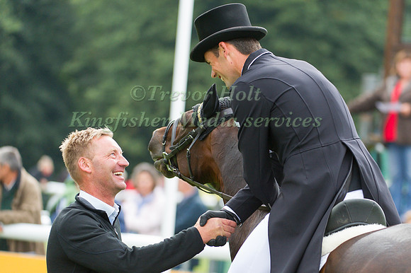 Erik Duvander congratulates Jonathan Paget after his Dressage test