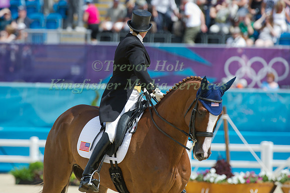Karen O'Connor and Looks back to check her score
