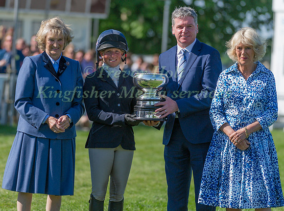 Rosalind Canter receiving the Laurence Rook Trophy for best British rider not to have previously completed Badminton, with the Duchess of Beaufort, Lance Bradley and the Duchess of Cornwall
