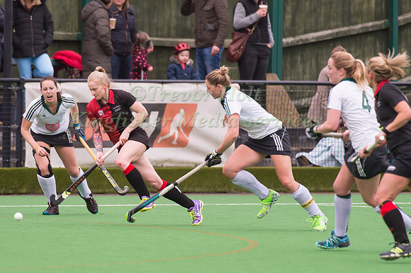 Sarah Inghamof Bowdon Hightown running at the Buckingham defence