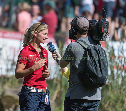 Julia Krajewski being interviewed on the cross country course