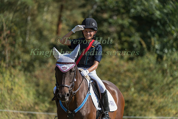 Young rider collecting sheets on the cross country course