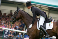 Aoife Clark (IRL) riding Vaguely North patting horse at the end of her test