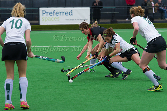 Sally Walton of Bowdon Hightown under pressure from the Buckingham Defenders
