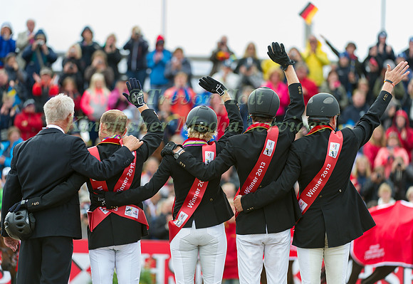 The Gold Medal Medal winning German Team salute the crowd
